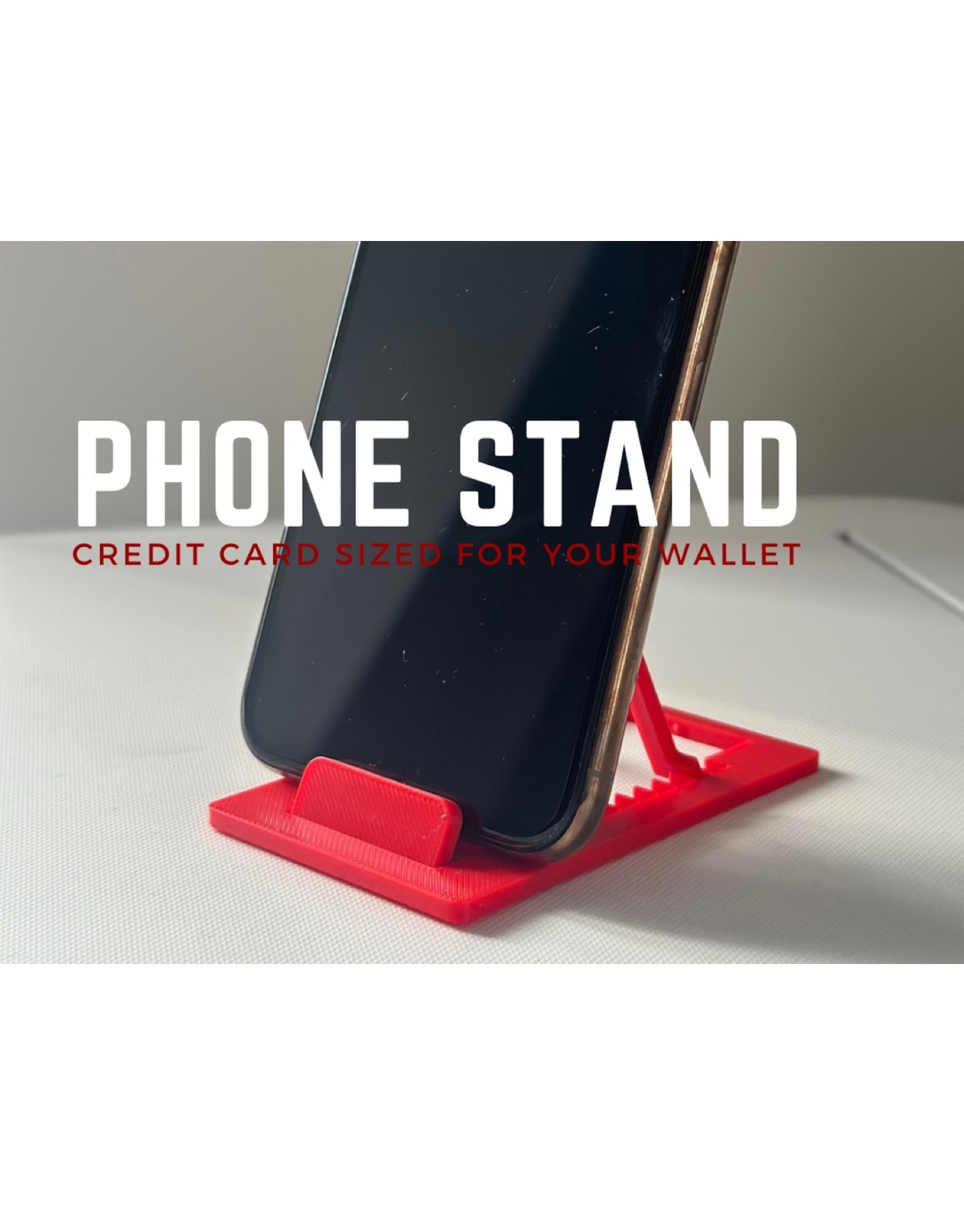 Folding phone stand next to a credit card